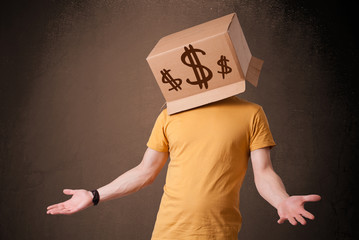 Young man gesturing with a cardboard box on his head with dollar