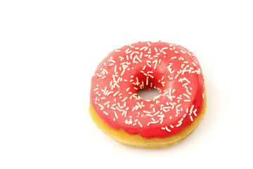 Fototapeta na wymiar freshly baked pink glazed donut with sprinkles