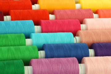 colorful spindles of yarn background