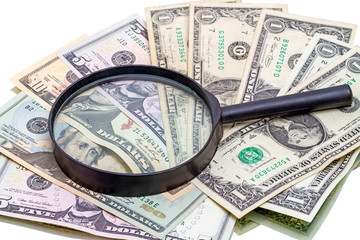 Dollars and magnifier