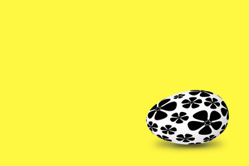 black-and-white easter egg decorated with ornament