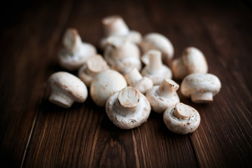 White mushrooms on wood table