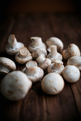 White mushrooms on wood table