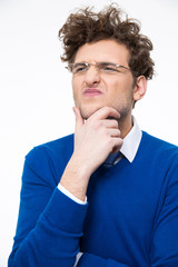 Portrait of a pensive young businessman in glasses