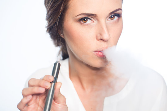 Young woman portrait with e-cigarette