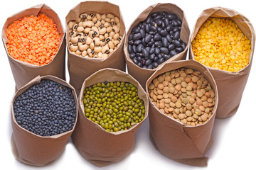 Seven of paper bags with dry bean products
