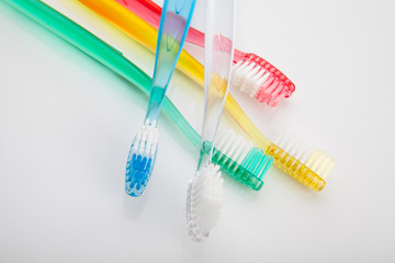 tooth brush, tooth paste  in glass  on white background