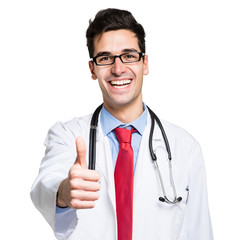 Fototapeta premium Portrait of a friendly doctor smiling giving thumbs up