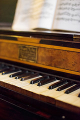 Fototapeta na wymiar Vintage photo of old piano with notes.