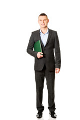 Young businessman holding his note book