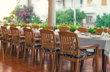 Fototapeta na wymiar Setout table with tableware in modern restaurant.