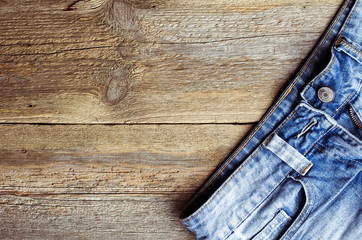 pocket jeans on wooden background