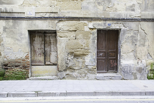 Old wall with wooden doors