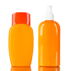 Bottles with suntan cream isolated on white