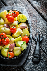 Vegetables with rosemary and garlic on barbecue dish