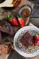 overhead view on chocolate torte cake served on plate