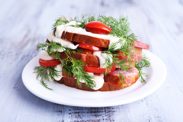 Sandwich with sausage, tomato and mayonnaise