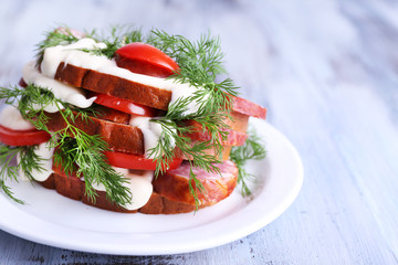 Sandwich with sausage, tomato and mayonnaise