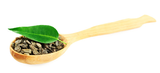 Wooden spoon with green tea with leaf isolated on white