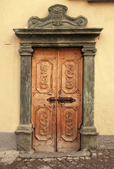 Vintage brown wood medieval door, Italy
