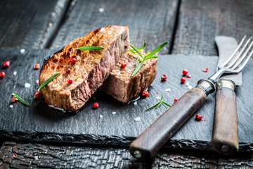 Hot roasted beef with fresh rosemary ready to eat