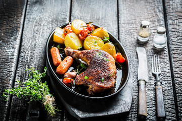 Roasted piece of chicken with fresh marjoram