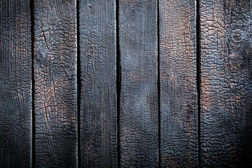Obraz premium Black burnt wooden table