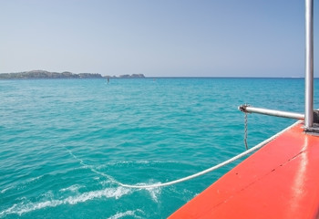 Red boat anchor rope in turquoise green clear water, Mallorca