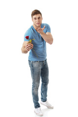 Handsome man with red rose.