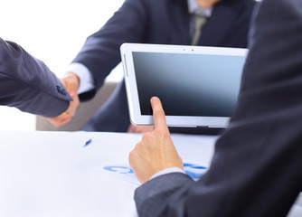 Obraz premium man with finger touching screen of a digital tablet