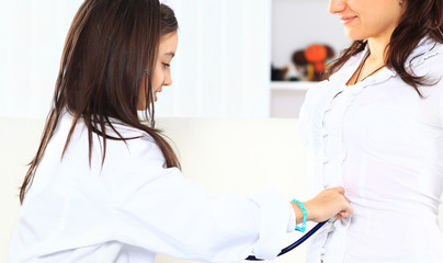 Fototapeta premium The little girl with her mother played in doctors.