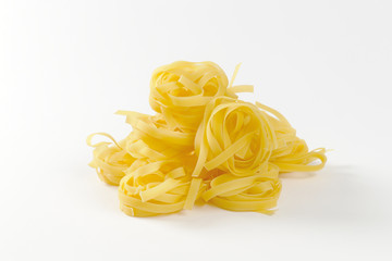 Nests of dry pasta tagliatelle