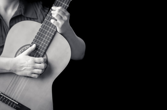 Musician hands playing a classic guitar