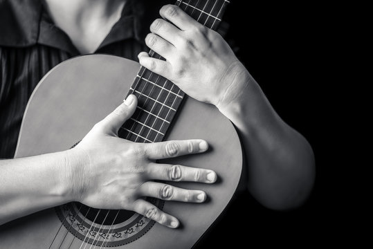 Musician hands playing a classic guitar