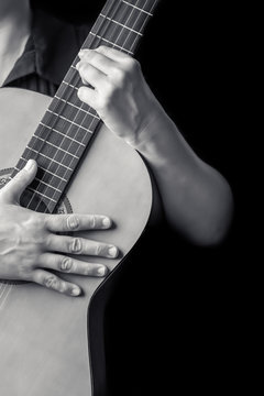 Musician hands playing a classic guitar