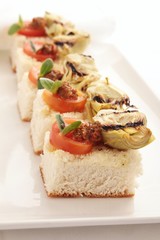 artichoke tomato pesto canapes