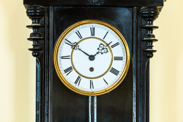 Closeup old clock on wall