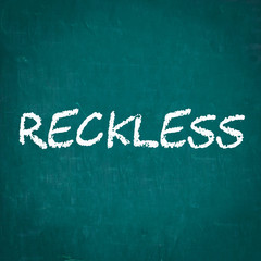 RECKLESS written on chalkboard