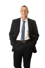 Businessman with hands in pockets