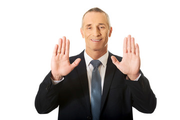 Businessman pressing abstract screen