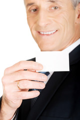 Businessman showing a blank identity name card