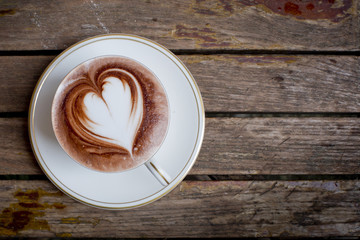 Cup of coffee on a wooden table