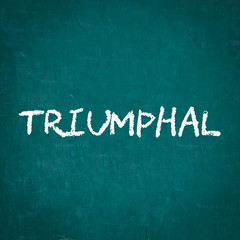 TRIUMPHAL written on chalkboard