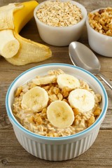Banana walnut overnight oatmeal in a bowl on wood table