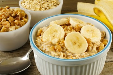 Banana walnut overnight oatmeal in a bowl on wood table