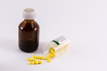 Medicine Pills and Hypodermic Syringe.