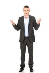 Angry businessman with open hands