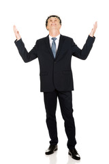 Smiling businessman with open arms up