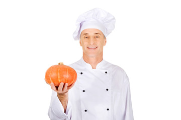 Male chef with a pumpkin