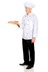 Chef baker with italian pizza